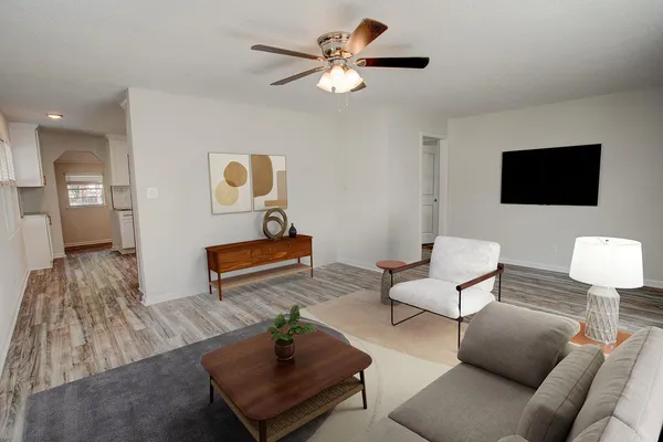 a living room with furniture and a flat screen tv