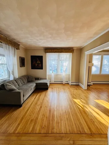 a living room with a couch and a window