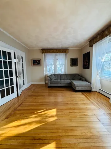 a large room with a bed and cabinets