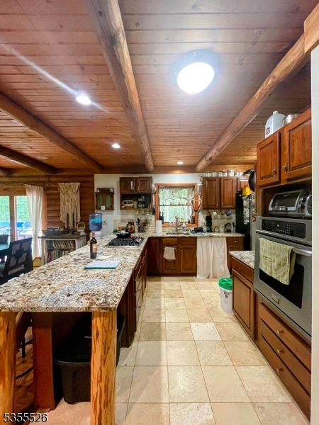 101 Flatbrook Road Branchville, NJ 07827 - Photo 15 of 28 a kitchen with a stove kitchen island stainless steel appliances lots of counter top space