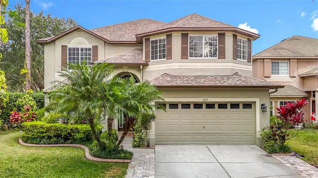 a view of a livingroom with furniture and stairs