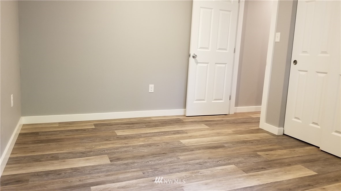 7531 Lower Ridge Road Everett, WA 98203 - Photo 14 of 25 a view of empty room with wooden floor
