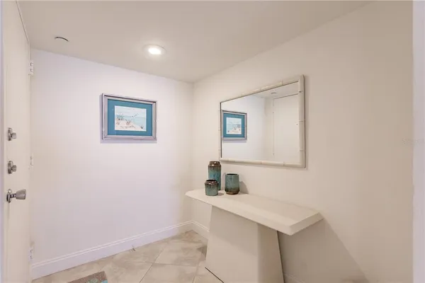 a room with a sink and a mirror