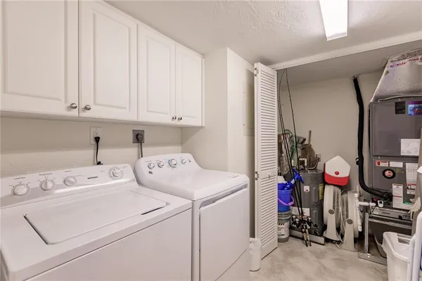 a view of storage and utility room with washer and dryer