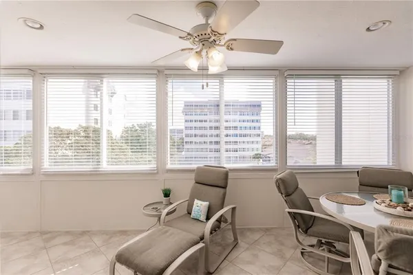 a workspace with furniture and a large window