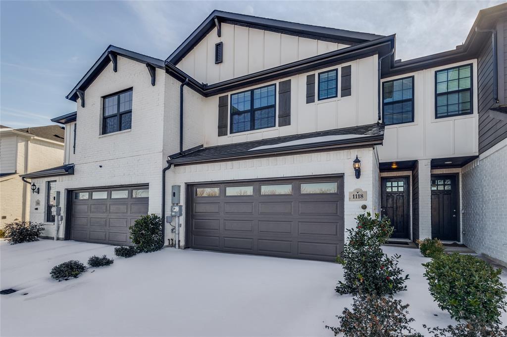 1118 Houston Way Lewisville, TX 75077 - Photo 1 of 12 a front view of a house with a yard and garage