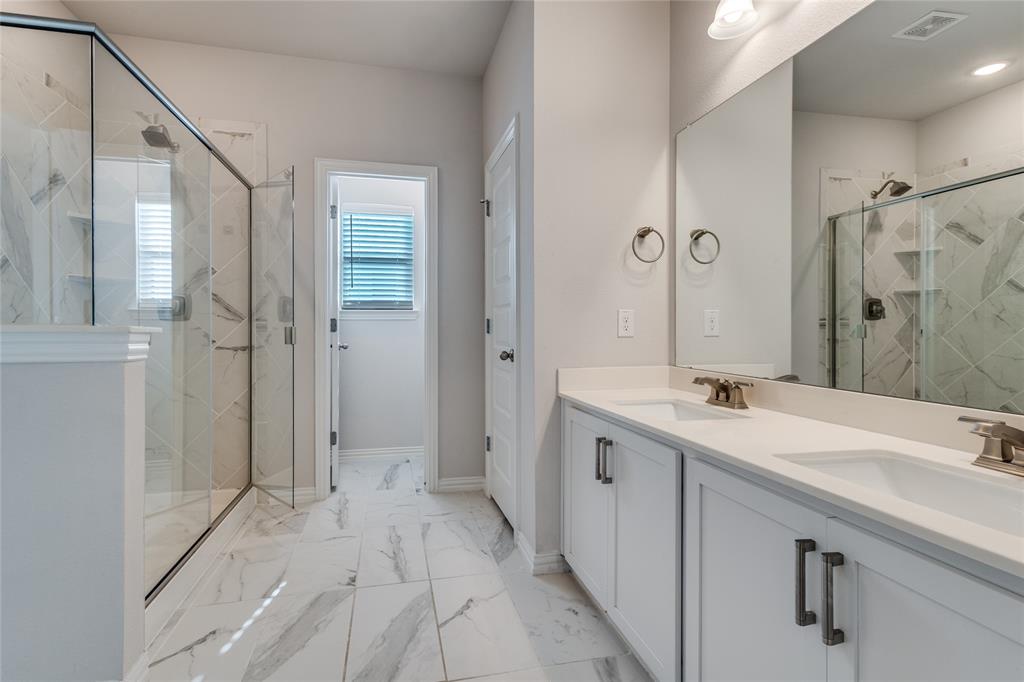 1118 Houston Way Lewisville, TX 75077 - Photo 11 of 12 a bathroom with a sink shower and a mirror