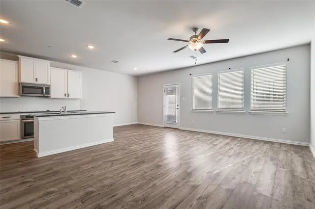 a view of kitchen with wooden floor and window