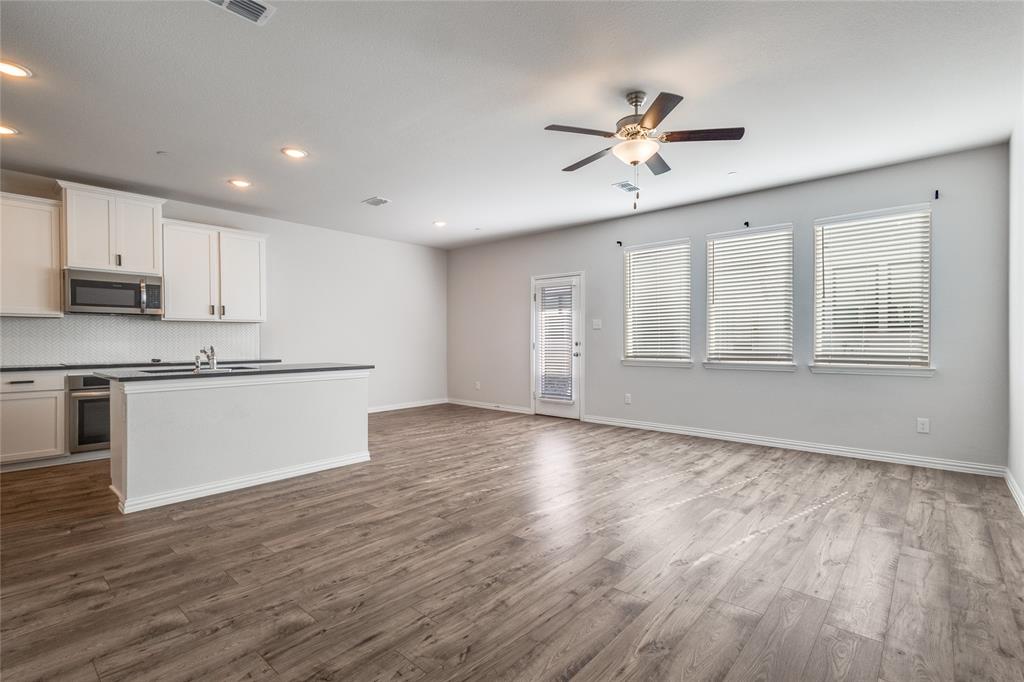 1118 Houston Way Lewisville, TX 75077 - Photo 3 of 12 a view of kitchen with wooden floor and window