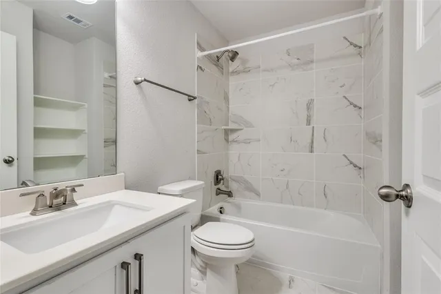 an empty room with windows and entrance