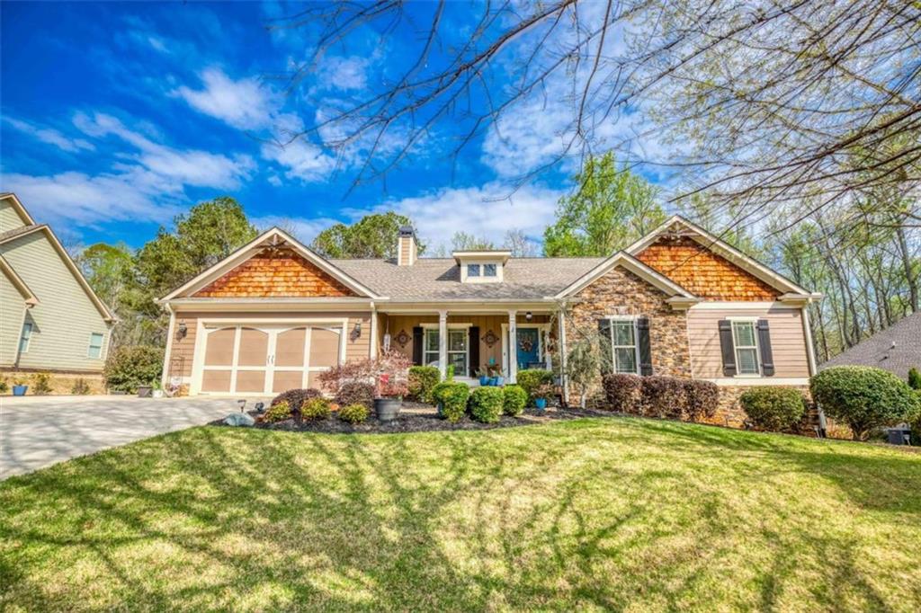 1948 Hearthstone Court Winder, GA 30680 - Photo 1 of 87 a front view of house with yard and trees around