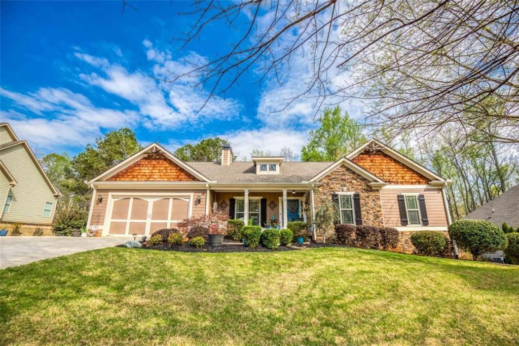 1948 Hearthstone Court Winder, GA 30680 - Photo 2 of 87 a front view of a house with a yard