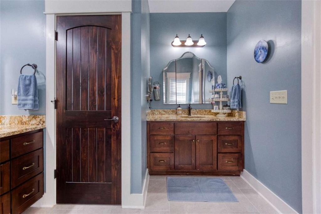 1948 Hearthstone Court Winder, GA 30680 - Photo 51 of 87 a bathroom with a sink and a mirror