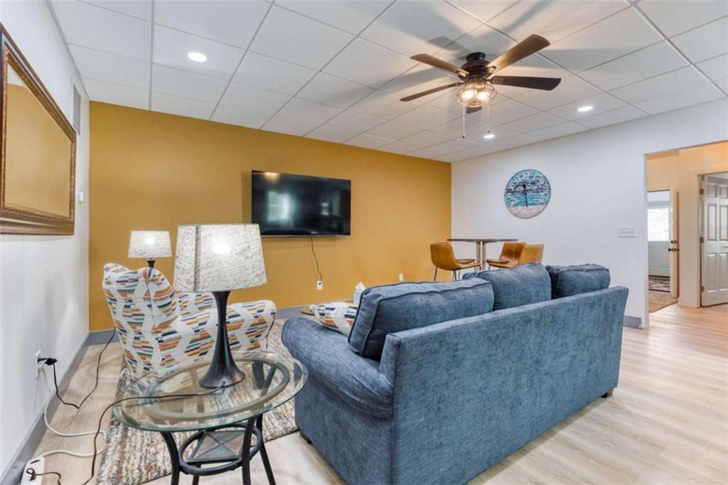 1948 Hearthstone Court Winder, GA 30680 - Photo 63 of 87 a living room with furniture and a flat screen tv