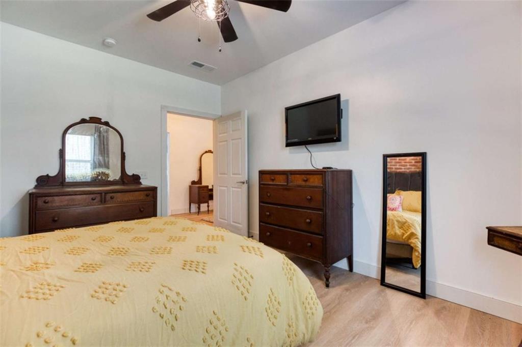 1948 Hearthstone Court Winder, GA 30680 - Photo 70 of 87 a bedroom with a bed and a flat screen tv