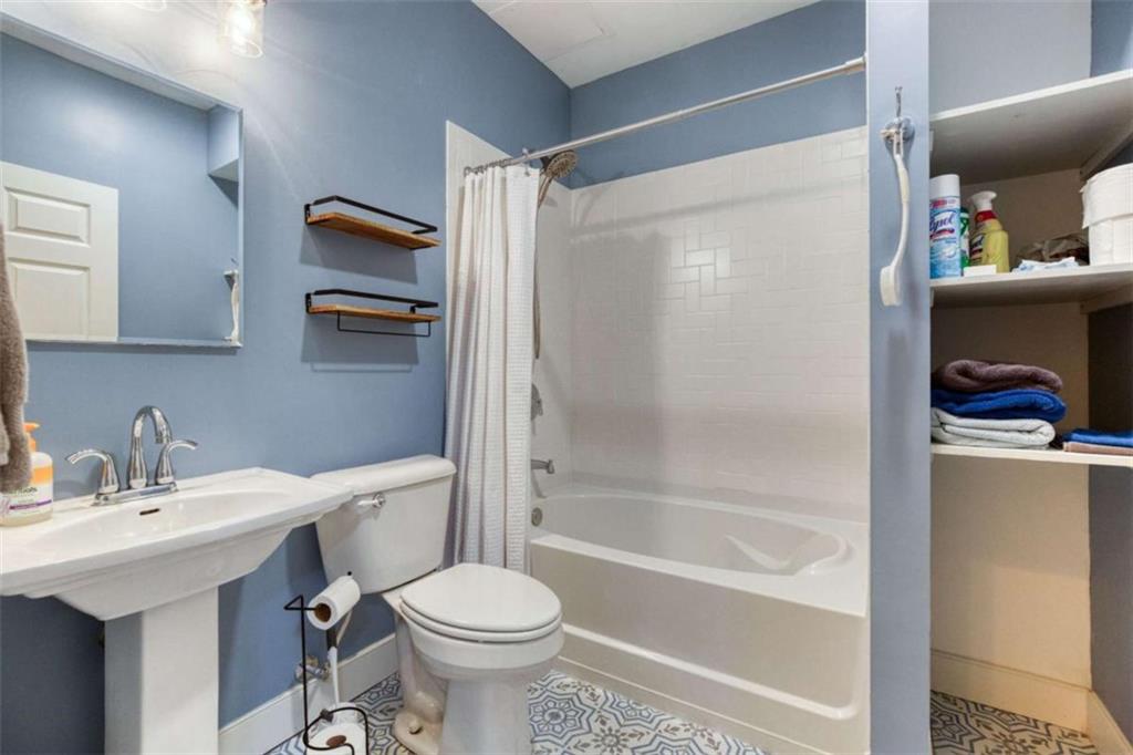 1948 Hearthstone Court Winder, GA 30680 - Photo 71 of 87 a bathroom with a sink toilet and shower