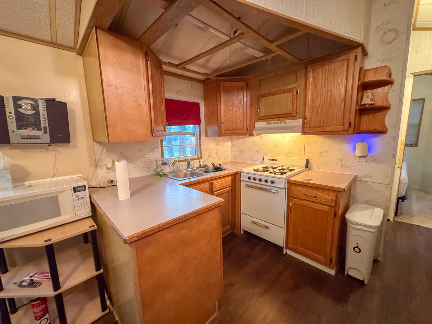 29-140 Woodhaven Sublette, IL 61367 - Photo 11 of 20 a kitchen with cabinets appliances and a sink