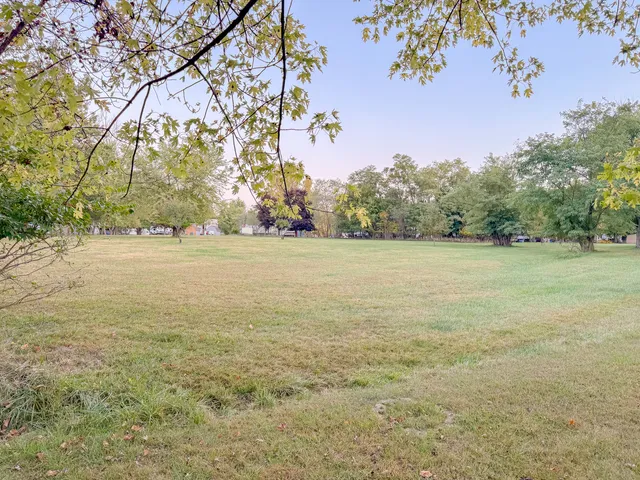 a living room with furniture and large windows