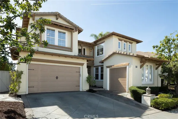a front view of a house with a garage
