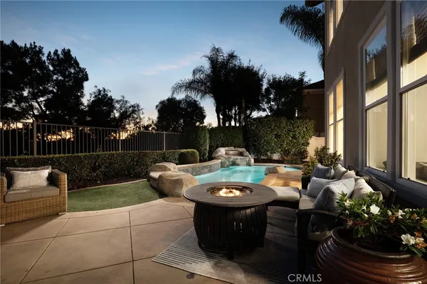 a view of a backyard with sitting area