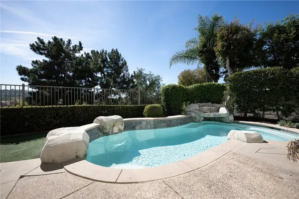 a view of a swimming pool with a sitting space