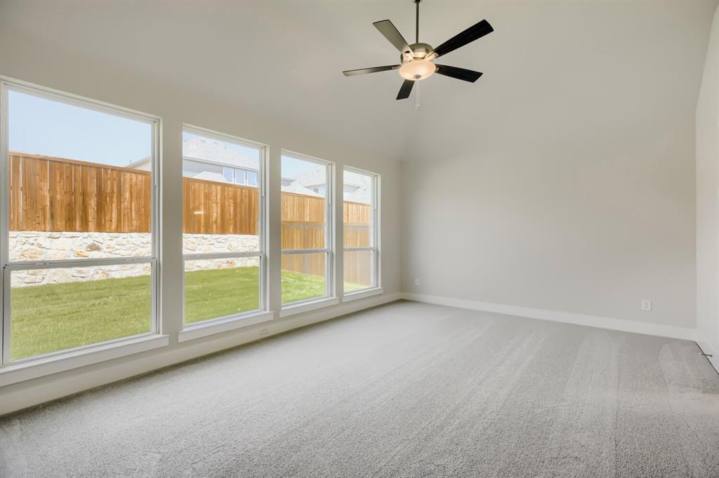 4407 Windy Point Road Oak Point, TX 75068 - Photo 10 of 27 Vaulted ceiling room featuring light gray carpet flooring and multiple large windows