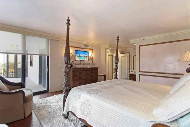 a spacious bathroom with a sink a toilet a mirror and shower