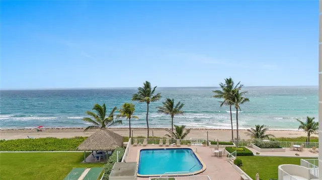 a view of a swimming pool with a deck