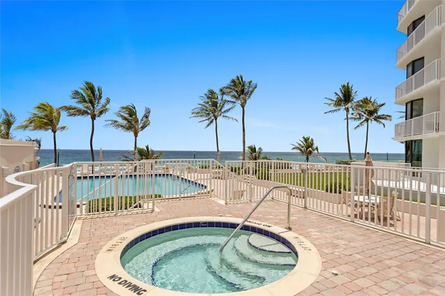 a view of a chair and tables in the patio