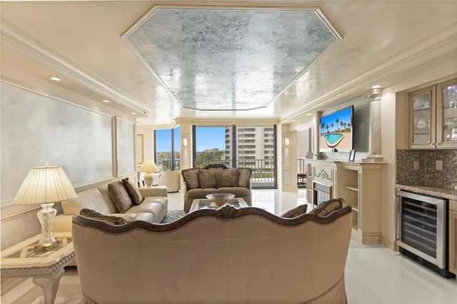 a living room with furniture fireplace and a flat screen tv