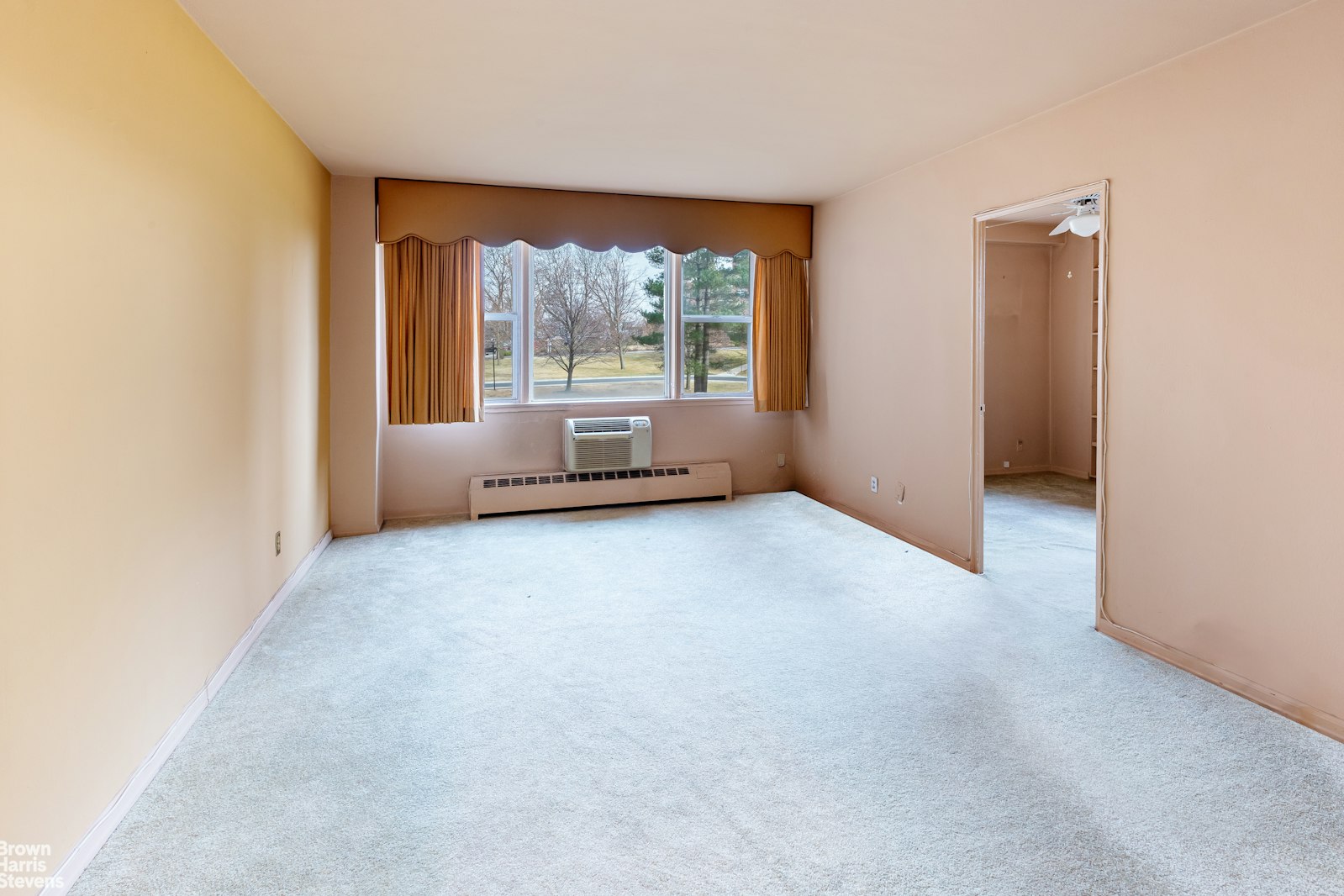 5700 Arlington Avenue, Unit 2X Bronx, NY 10471 - Photo 2 of 23 an empty room with a window