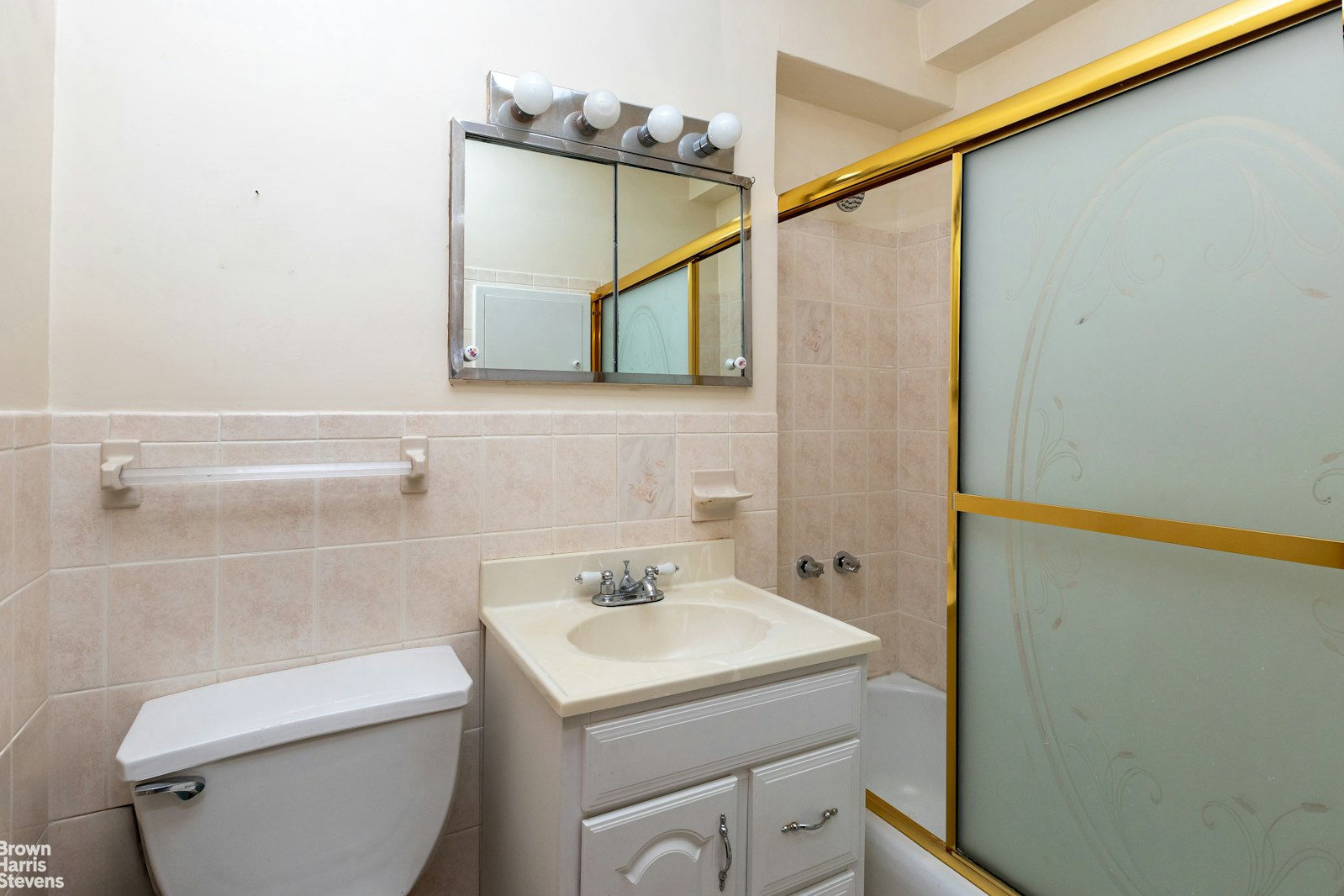 5700 Arlington Avenue, Unit 2X Bronx, NY 10471 - Photo 7 of 23 a bathroom with a sink a toilet and shower