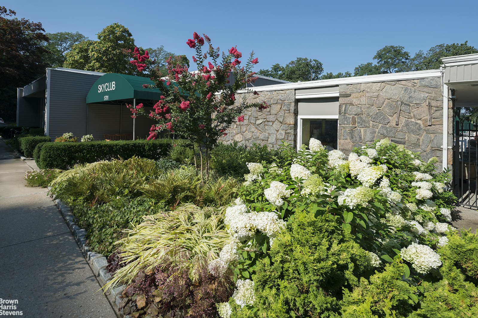5700 Arlington Avenue, Unit 2X Bronx, NY 10471 - Photo 9 of 23 a view of a house with a flower garden