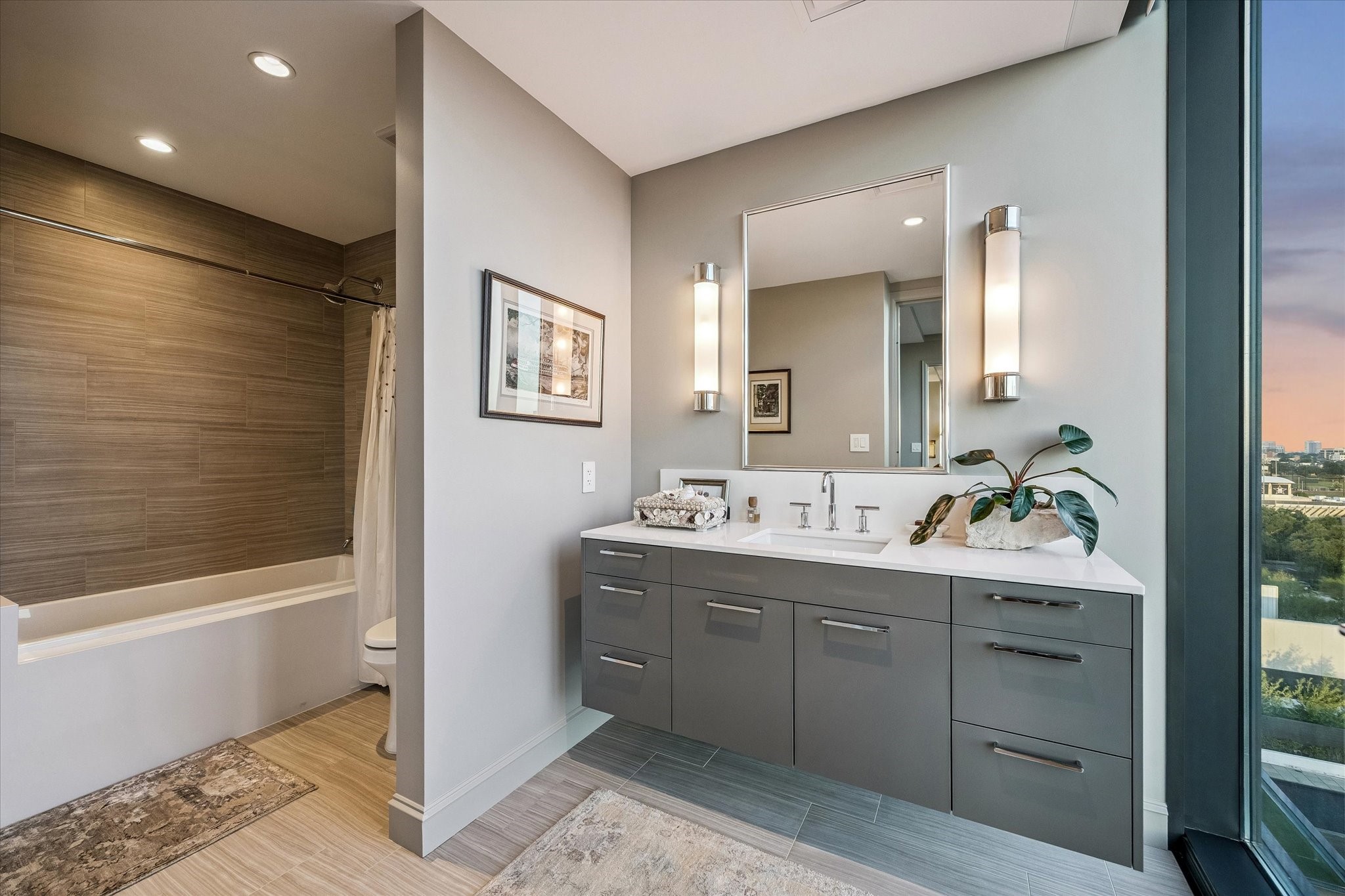 3433 Westheimer Road, Unit 706 Houston, TX 77027 - Photo 18 of 41 a bathroom with a double vanity sink mirror and bathtub