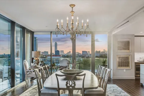 a view of a dining room with furniture window and outside view