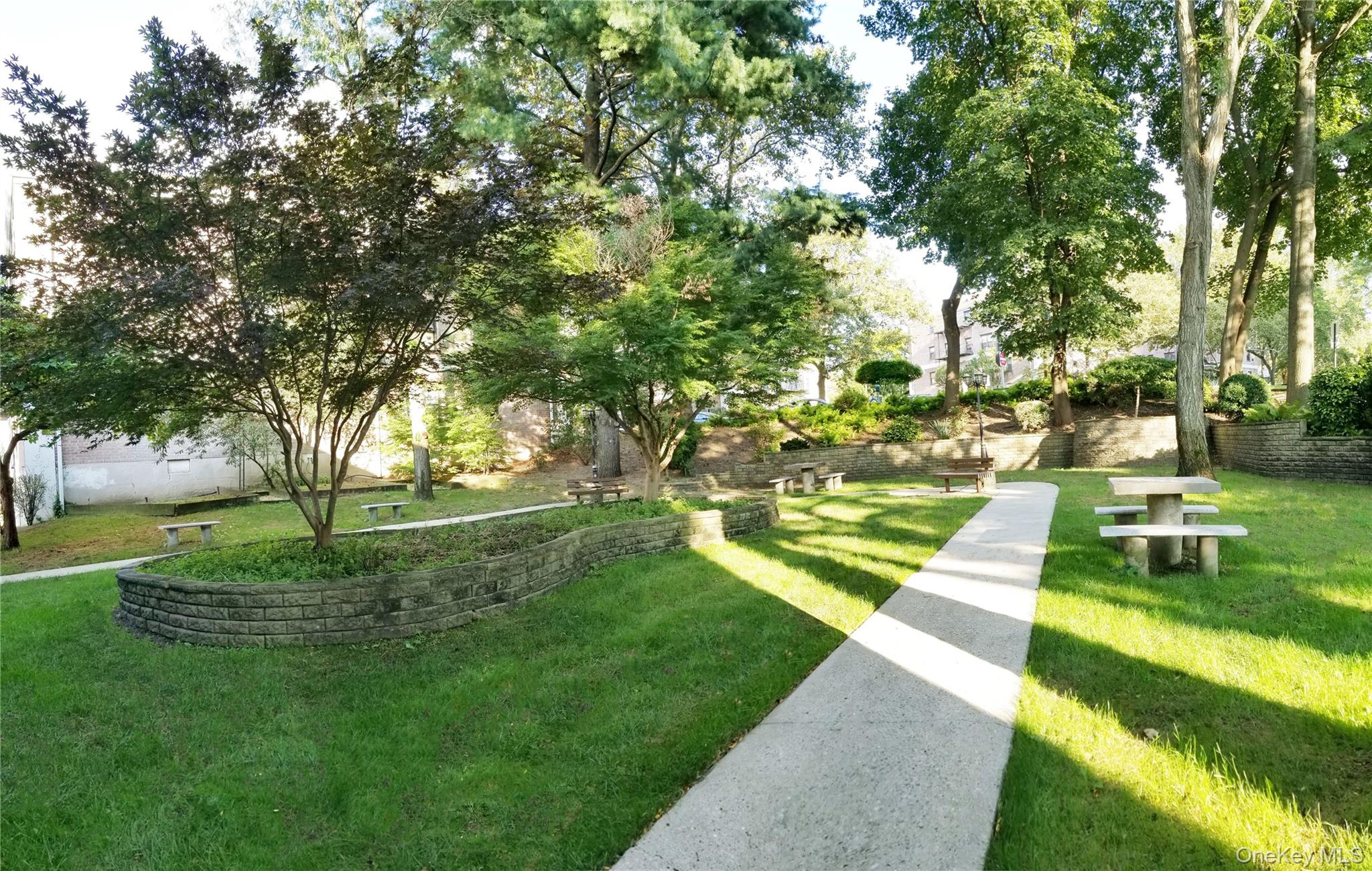 7 Terrace Circle, Unit 3D Great Neck, NY 11021 - Photo 26 of 31 a view of a park with large trees
