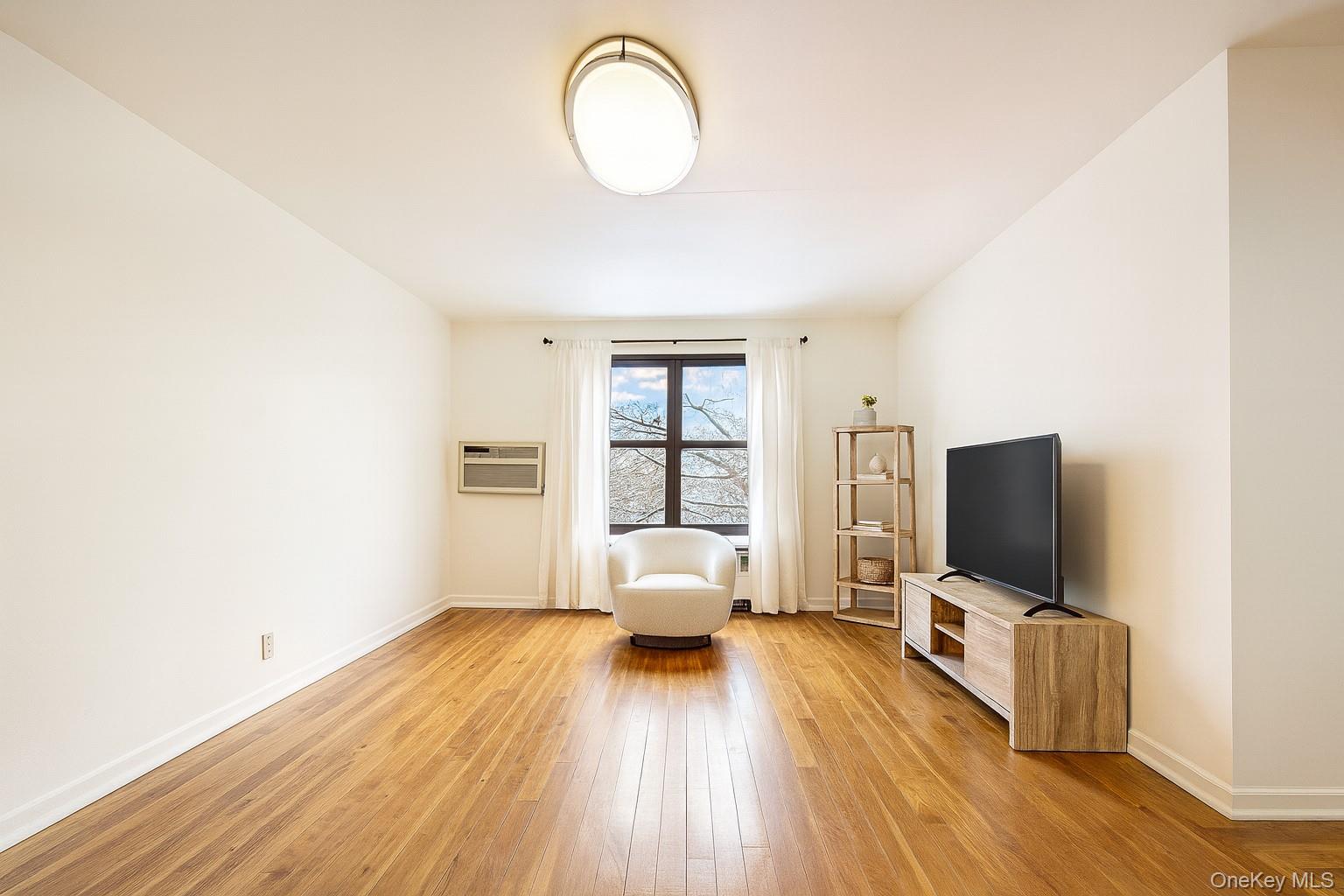 7 Terrace Circle, Unit 3D Great Neck, NY 11021 - Photo 3 of 31 a view of a livingroom with furniture and wooden floor
