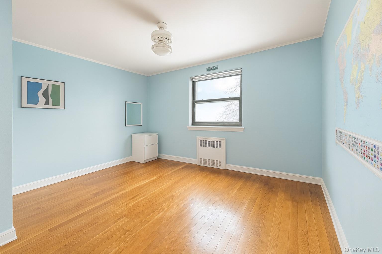 7 Terrace Circle, Unit 3D Great Neck, NY 11021 - Photo 8 of 31 a view of a room with a wooden floor and a window