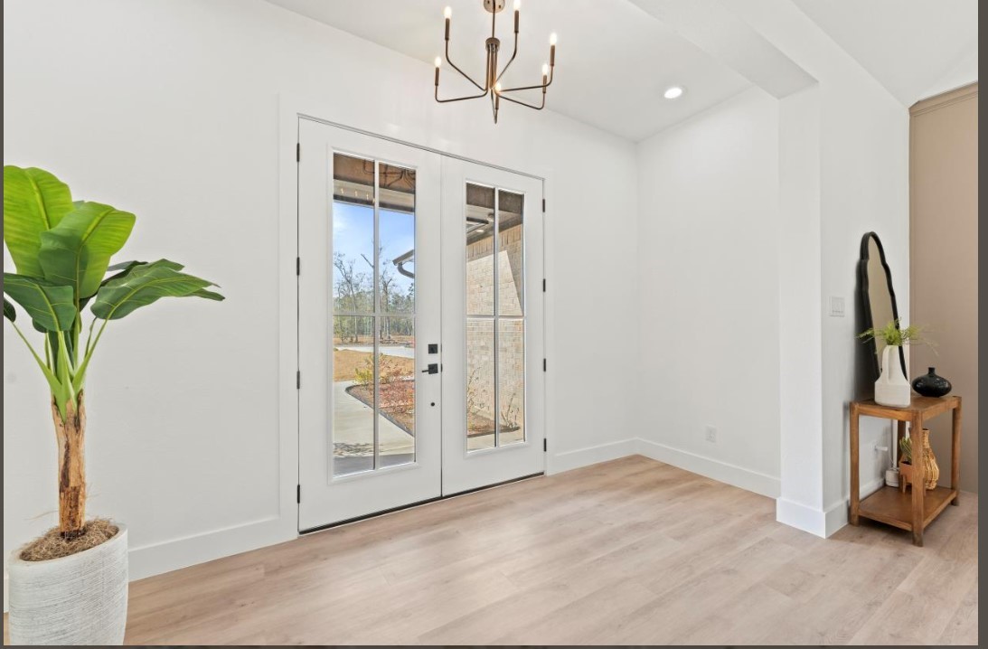 15045 Tybee Lane Conroe, TX 77306 - Photo 11 of 41 a view of an entryway with wooden floor
