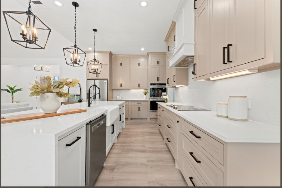 15045 Tybee Lane Conroe, TX 77306 - Photo 12 of 41 a kitchen with kitchen island granite countertop lots of white cabinets