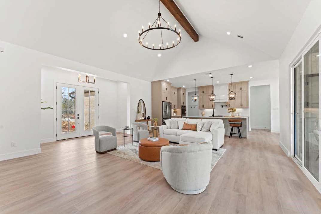 15045 Tybee Lane Conroe, TX 77306 - Photo 17 of 41 a living room with furniture a dining table and chairs