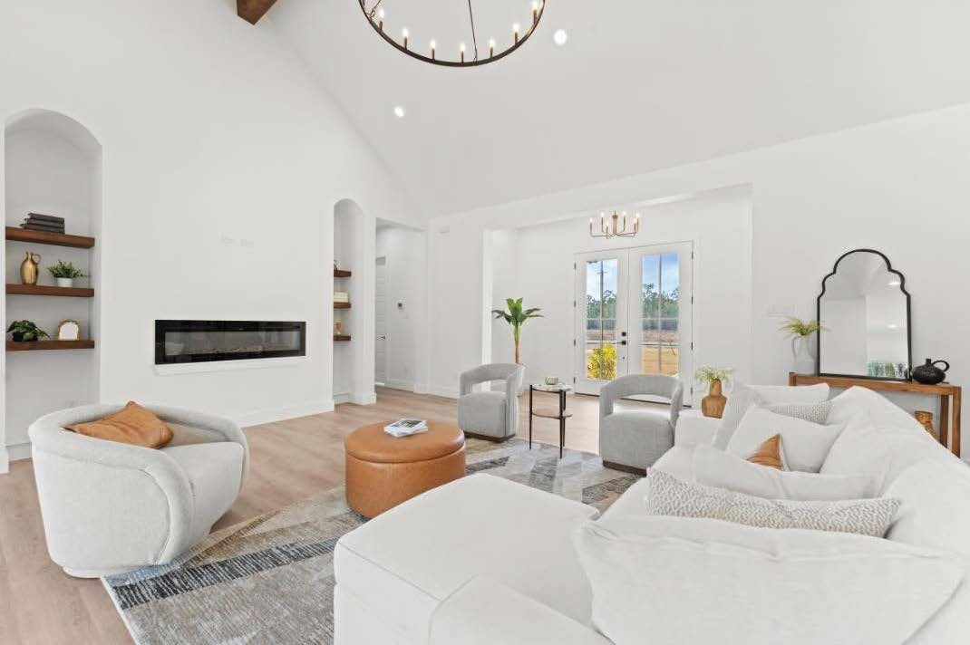 15045 Tybee Lane Conroe, TX 77306 - Photo 18 of 41 a living room with furniture a rug and white walls