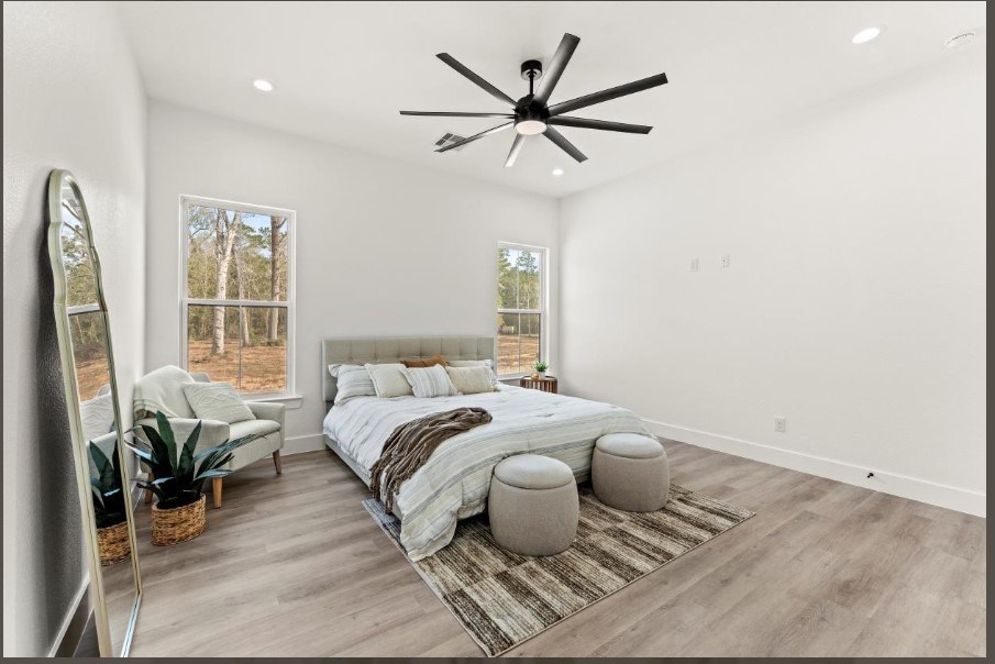 15045 Tybee Lane Conroe, TX 77306 - Photo 20 of 41 a bedroom with a large bed and a window