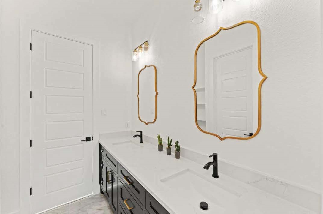 15045 Tybee Lane Conroe, TX 77306 - Photo 24 of 41 a bathroom with a sink and a mirror