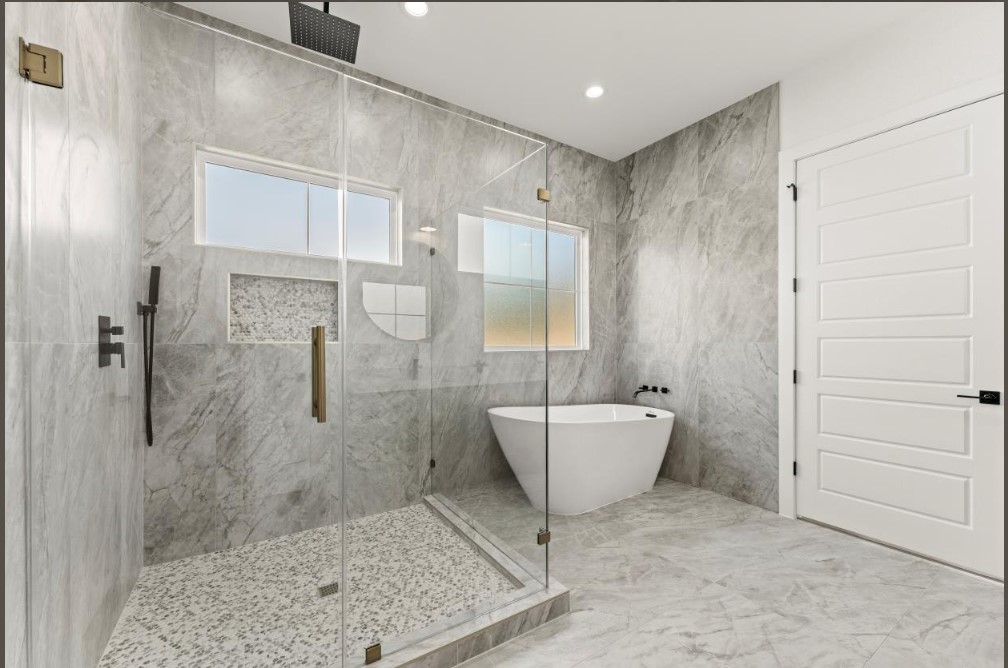 15045 Tybee Lane Conroe, TX 77306 - Photo 25 of 41 a bathroom with a bathtub and shower