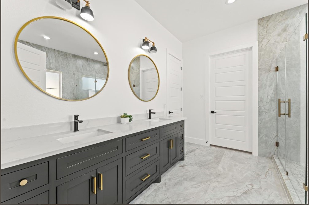 15045 Tybee Lane Conroe, TX 77306 - Photo 26 of 41 a bathroom with a double vanity sink and a mirror