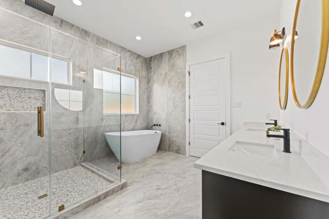 15045 Tybee Lane Conroe, TX 77306 - Photo 27 of 41 a bathroom with a bathtub and shower