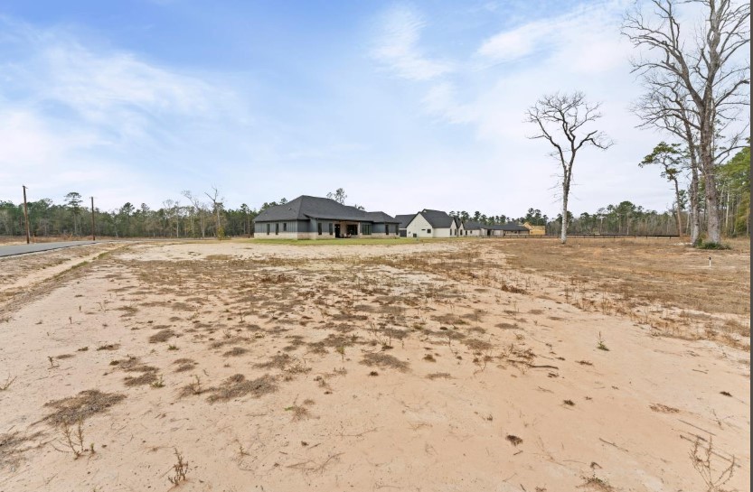 15045 Tybee Lane Conroe, TX 77306 - Photo 35 of 41 a view of lake view and mountain in the back