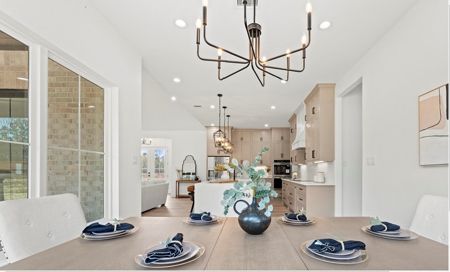15045 Tybee Lane Conroe, TX 77306 - Photo 37 of 41 a kitchen with stainless steel appliances granite countertop a sink and cabinets