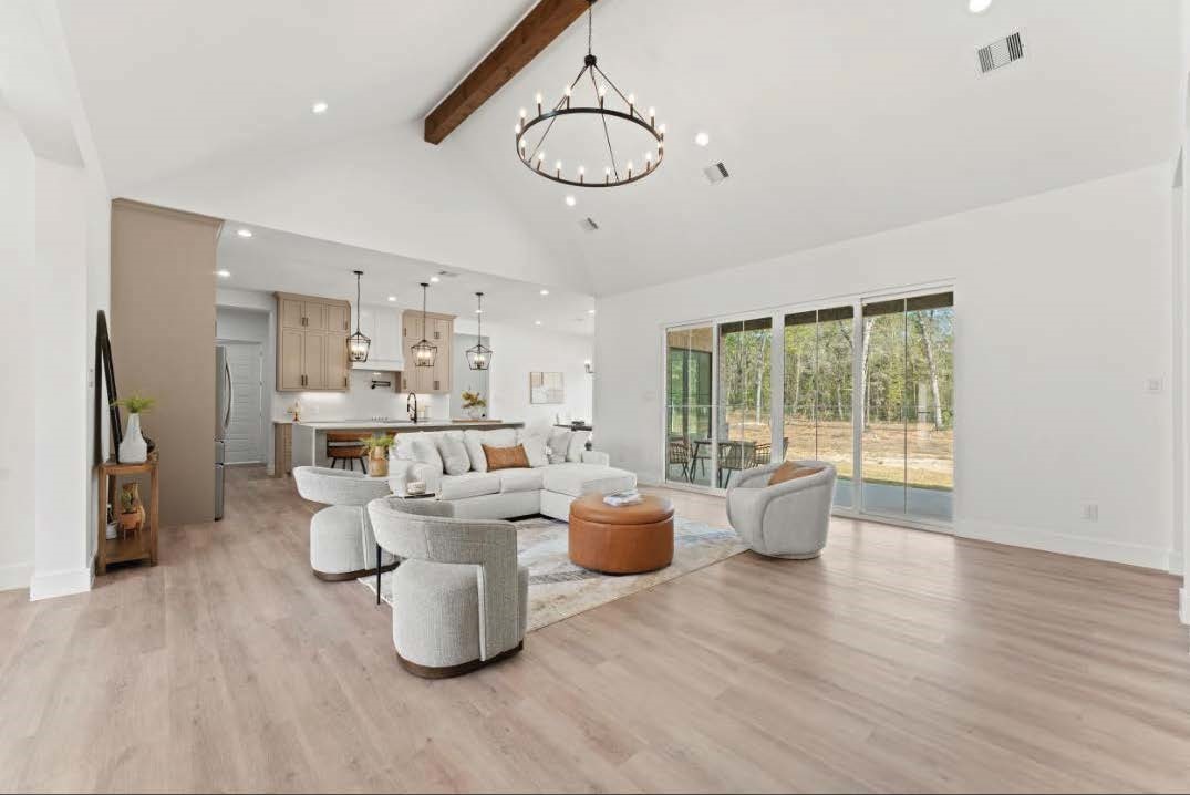15045 Tybee Lane Conroe, TX 77306 - Photo 4 of 41 a living room with furniture and a large window